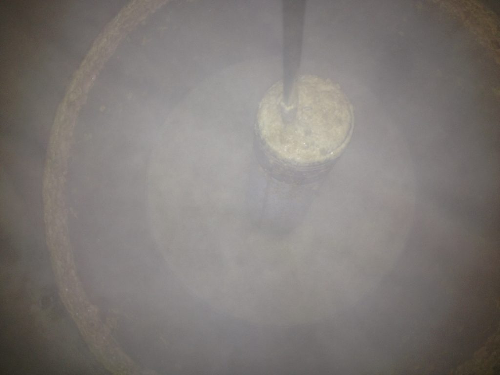 Behind the C02 haze, here is the filter over the dip tube in the fermenter after transferring to the serving keg.